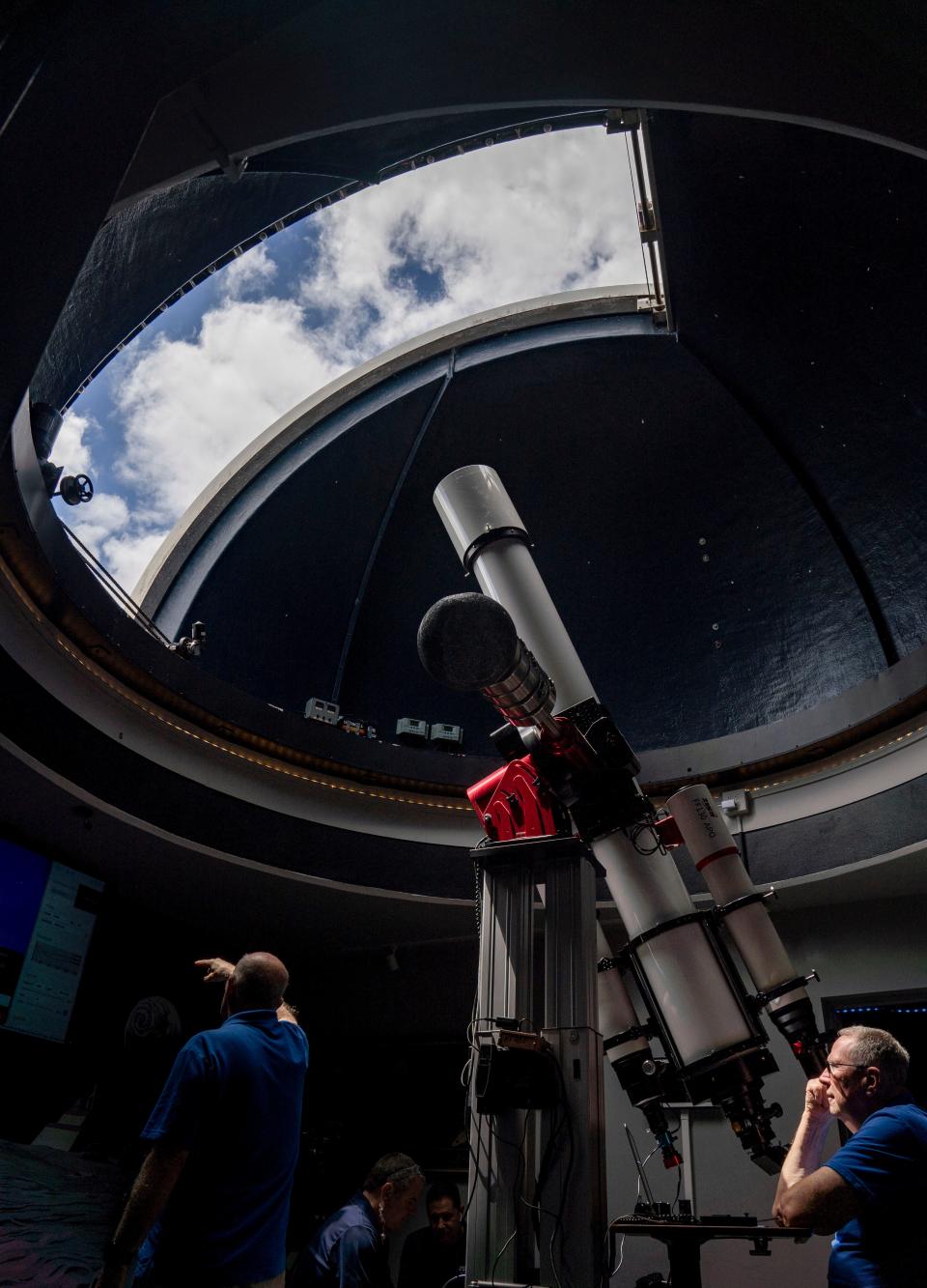 Astronomer Bill Bucklew readies the telescope in the Marmot Observatory for the partial solar eclipse at the Cox Science Center on April 8, 2024 in West Palm Beach, Florida.