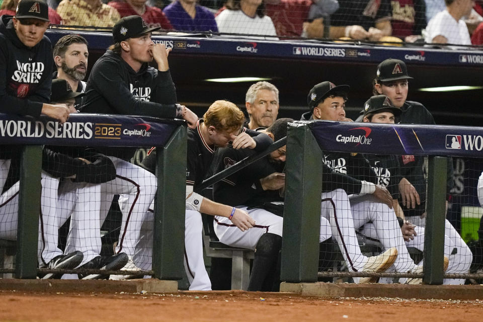 Members of the Arizona Diamondbacks watch during the seventh inning in Game 4 of the baseball World Series against the Texas Rangers Tuesday, Oct. 31, 2023, in Phoenix. (AP Photo/Brynn Anderson)