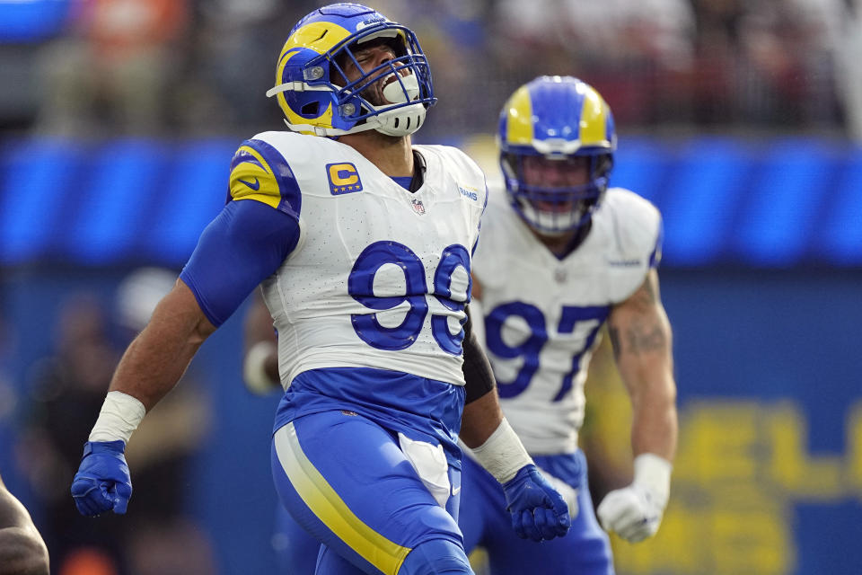 FILE - Los Angeles Rams defensive tackle Aaron Donald (99) reacts after a tackle on Cleveland Browns running back Jerome Ford during the first half of an NFL football game Sunday, Dec. 3, 2023, in Inglewood, Calif. Defensive lineman Aaron Donald has announced his retirement after a standout 10-year career with the Los Angeles Rams. The three-time AP NFL Defensive Player of the Year made his surprising announcement on social media Friday, March 15, 2024.(AP Photo/Mark J. Terrill, File)