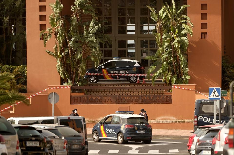 Spanish police officers stand outside the H10 Costa Adeje Palace hotel in Tenerife (AP)