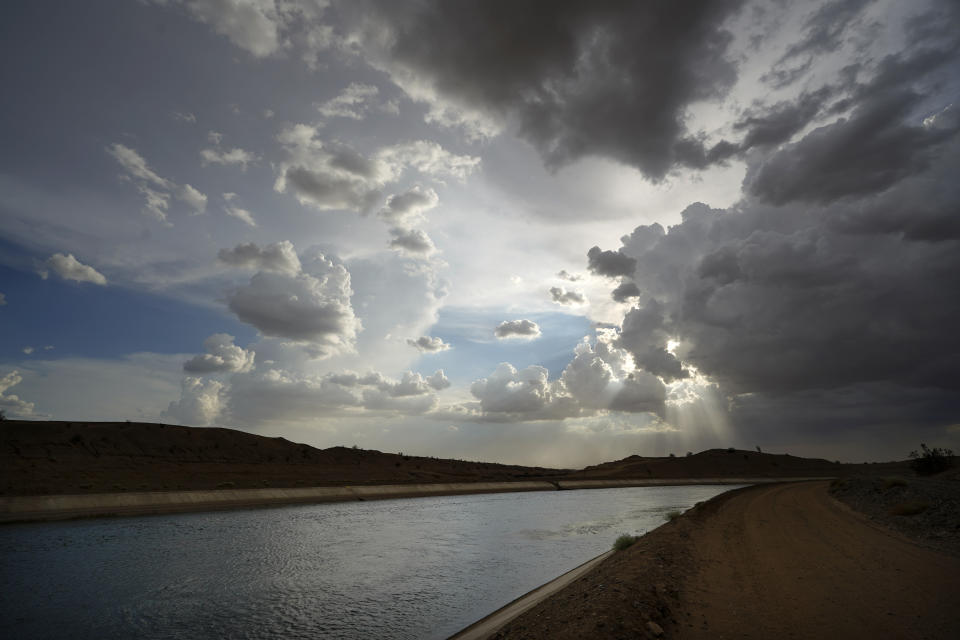 Water flows along the All-American Canal Saturday, Aug. 13, 2022, near Winterhaven, Calif. The canal conveys water from the Colorado River into the Imperial Valley. (AP Photo/Gregory Bull)