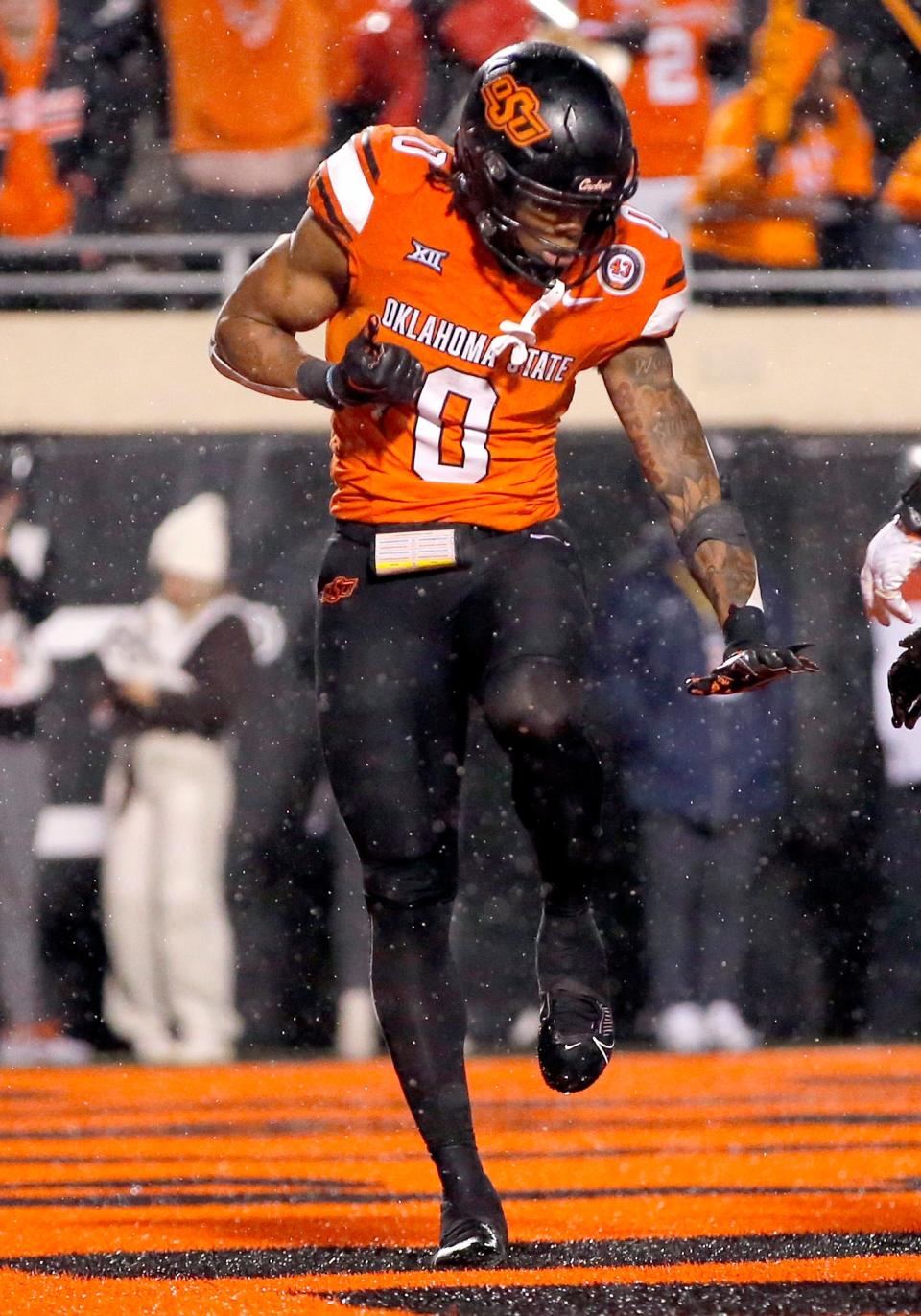 Oklahoma State's Ollie Gordon II celebrates his touchdown in the second overtime of Saturday's game against Brigham Young at Boone Pickens Stadium in Stillwater.