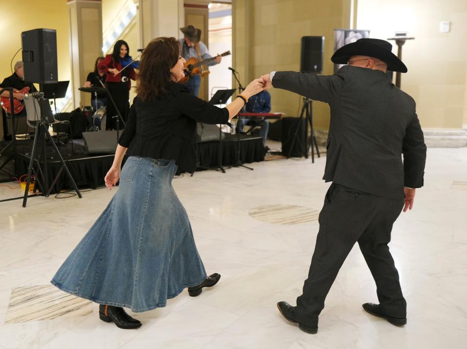 Rep. Tammy Townley and Sen. Blake Stephens dance at Bob Wills Day at the state Capitol Monday, March 6, 2023, in Oklahoma City.