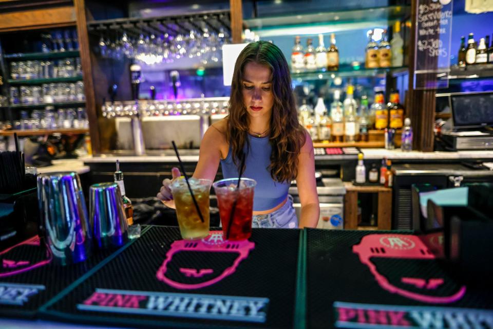 Amanda McLish makes drinks for a customer Sept. 23 at VZD's Restaurant and Bar in Oklahoma City. The establishment, which had occupied as a club since the late 1970s at 4200 N Western Ave., closed that month.