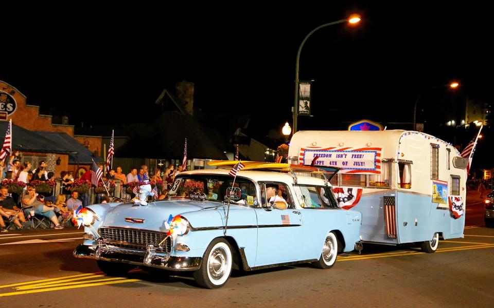 <p>Folks in Gatlinburg like to be ahead of the crowd, and they obviously don’t mind staying up late, because they’re proud each year to have the first Fourth of July parade in the country. The 42nd Annual Gatlinburg Fourth of July Midnight Parade starts at 12:01 a.m. on Tuesday, July 4, with an expected 80,000-100,000 spectators and a special salute to the men and women of the military services and the nation’s veterans.</p> <p>The annual River Raft Regatta, a race of unmanned floatables, starts at noon, with prizes for winners in various categories including the most creative boat. This popular and fun event takes place downtown on the Little Pigeon River.</p> <p>A free concert by the 100th Army Band begins the evening festivities at 8:30 p.m., leading to the downtown fireworks display at 10 p.m.</p> <p>Gatlinburg is located at the base of Great Smoky Mountains National Park. While you’re there, take a ride on the Gatlinburg Sky Lift, an open-air chairlift that rises 1,800 feet to the top of Crockett Mountain, providing breathtaking views of the Smoky Mountains.</p>