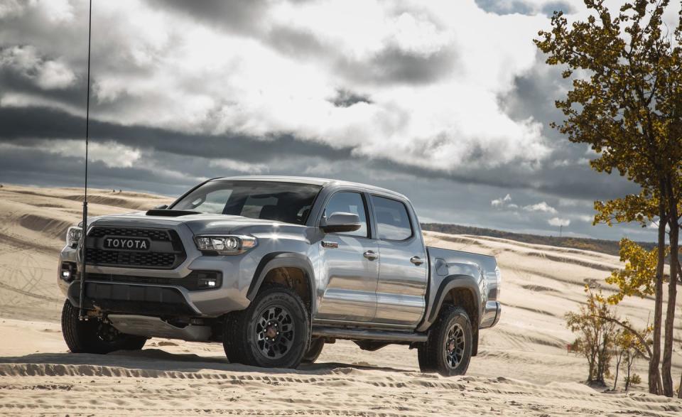 <p>If the mid-size truck market has a patron saint, <a rel="nofollow noopener" href="https://www.caranddriver.com/toyota/tacoma" target="_blank" data-ylk="slk:the Toyota Tacoma is it;elm:context_link;itc:0;sec:content-canvas" class="link ">the Toyota Tacoma is it</a>. Building on the rugged and reliable legacy of its predecessor (known globally as the Hilux), the Tacoma sacrifices some of the refinement and premium options found in newer competitors for an uncompromising (and appealing) do-it-all character. Available in extended cab and crew cab body styles with either a 6.1- or 5.5-foot bed, the Toyota is neither the most efficient nor spacious mid-sizer, and the go-kart driving position its low-mounted seats provides is unique. Skip the base 159-hp 2.7-liter four-cylinder engine for the optional 278-hp 3.5-liter V-6, and off-roaders will want to spring for the TRD Pro version, which has a heavy-duty off-road tuned suspension and requisite bro-tastic exterior graphics.</p>