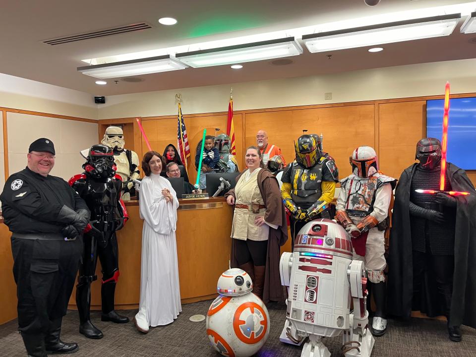 Judge Randall Howe, center, (holding light saber) marking National Adoption Day on November 18.