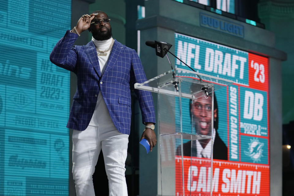 Miami Dolphins' Terron Armstead announces South Carolina defensive back Cam Smith as the selection by the Miami Dolphins during the second round of the NFL football draft, Friday, April 28, 2023, in Kansas City, Mo. (AP Photo/Jeff Roberson)