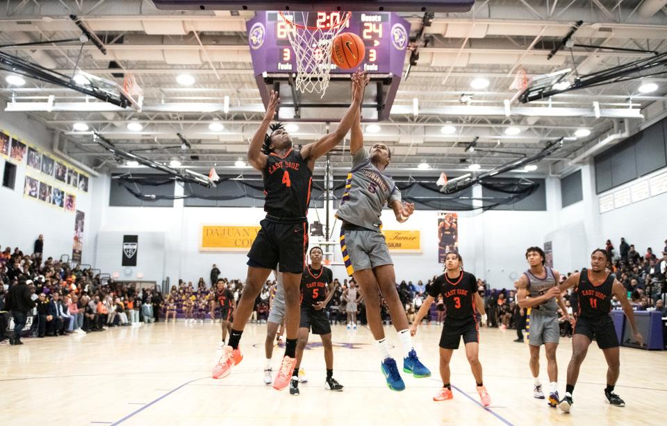 Camden's Teron Murray battles Eastside's Willy Love for a rebound during the boys basketball game played at Camden High School on Tuesday, January 10, 2023.  Camden defeated Eastside, 81-48.