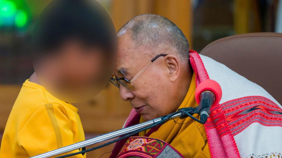 Tibetan spiritual leader the Dalai Lama  touches foreheads with a young boy, whose identity has been obscured by CBS News, before addressing a group of students  at the Tsuglakhang temple in Dharamshala, India, Feb. 28,  2023. / Credit: AP/Ashwini Bhatia