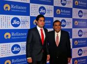 Mukesh Ambani (R), chairman of Reliance Industries Ltd, poses with his son Akash before addressing the company's annual general meeting in Mumbai, India September 1, 2016. REUTERS/Shailesh Andrade/File Photo