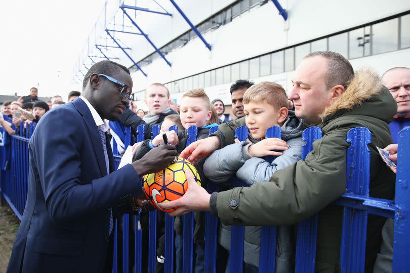 Oumar Niasse signs autographs for fans on arrival at the stadium prior to the FA Cup quarter-final between Everton and Chelsea at Goodison Park on March 12, 2016