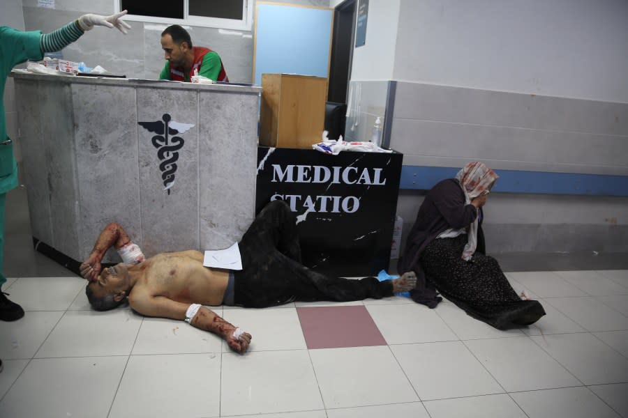 Palestinians wounded in Israeli strikes are brought to Shifa Hospital in Gaza City on Wednesday, Oct. 11, 2023. (AP Photo/Ali Mahmoud)