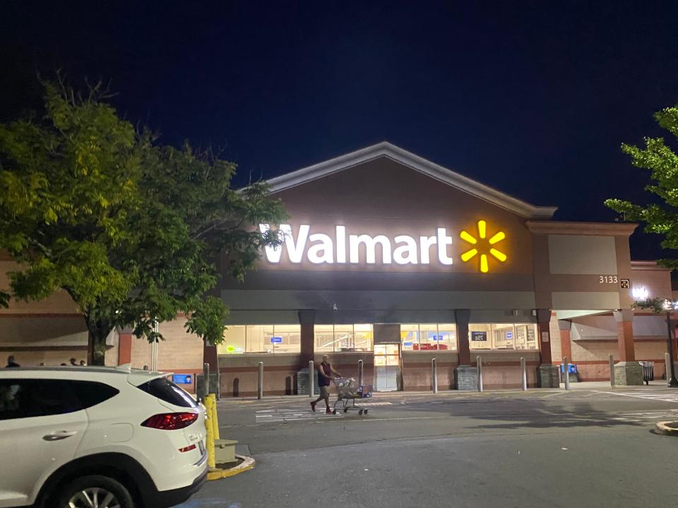 The exterior of a walmart from the parking lot