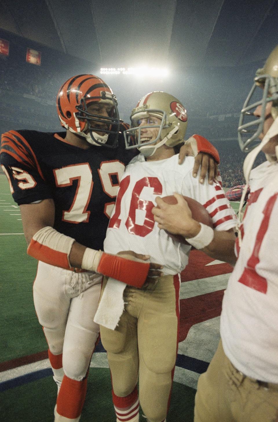 Cincinnati Bengals DE Ross Browner (79), congratulates former Notre Dame teammate and San Francisco 49ers QB Joe Montana following Super Bowl XVI on Jan. 25, 1982 in Pontiac, Mich.