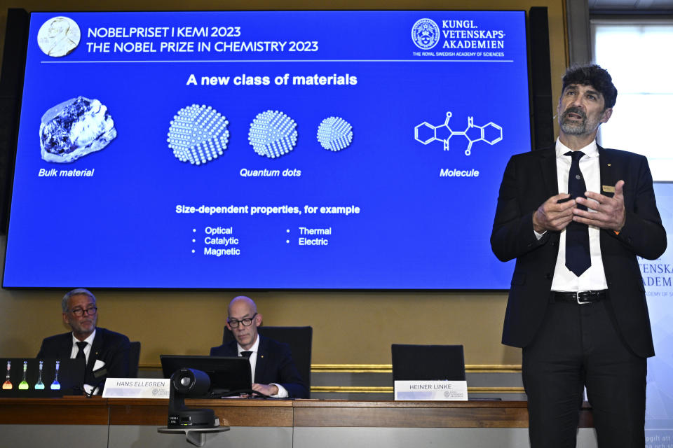 Nobel Committee for Chemistry Heiner Linke, right, presents the work of the winners of the 2023 Nobel Prize in Chemistry during a press conference at the Royal Academy of Sciences, in Stockholm, Wednesday, Oct. 4, 2023. The Nobel Prize in physics has been awarded to scientists Moungi Bawendi, Louis Brus and Alexi Ekimov for discovery and synthesis of quantum dots. (Claudio Bresciani/TT News Agency via AP)