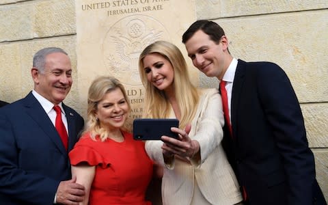 Israeli Prime Minister, Benjamin Netanyahu, and his wife, Sara, take a selfie with Ivanka Trump and Jared Kushner at the opening of the new embassy - Credit: Israel Press Office /Handout/Anadolu Agency/Getty Images