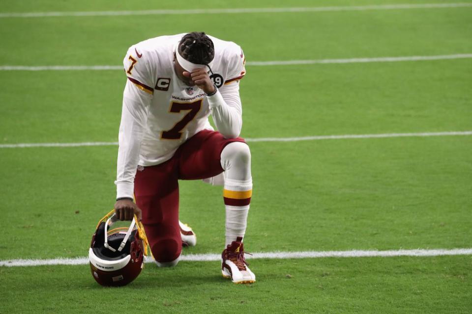GLENDALE, ARIZONA - SEPTEMBER 20: Quarterback Dwayne Haskins #7 of the Washington Football Team kneels on the field before the NFL game against the Arizona Cardinals at State Farm Stadium on September 20, 2020 in Glendale, Arizona. The Cardinals defeated the Washington Football Team 30-15. (Photo by Christian Petersen/Getty Images)