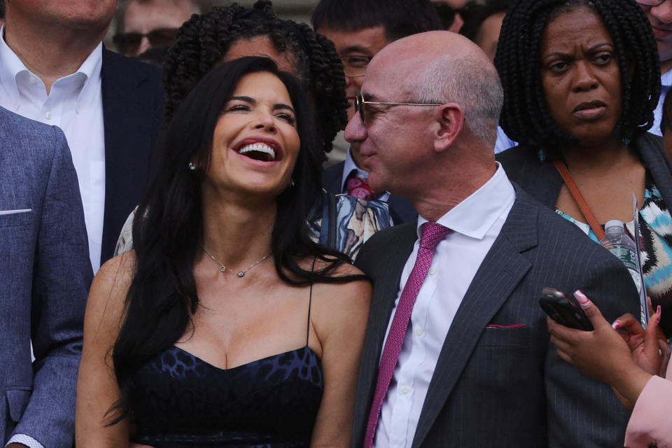 Amazon founder Jeff Bezos and Lauren Sanchez attend the Commencement ceremony at the Massachusetts Institute of Technology.