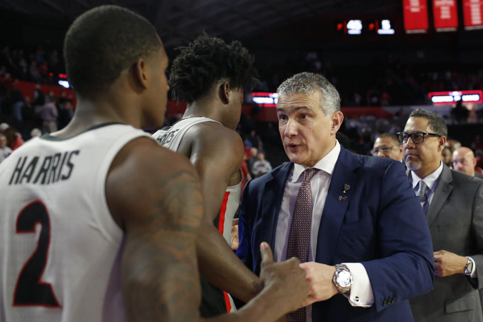 South Carolina coach Frank Martin speaks with Georgia's Jordan Harris (2) and another player after an NCAA college basketball game Wednesday, Feb. 12, 2020, in Athens, Ga. (Joshua L. Jones/Athens Banner-Herald via AP)