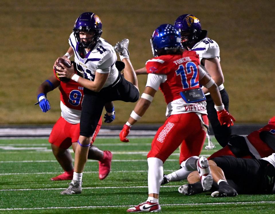 Wylie quarterback Bear Meng jumps away from a sack during Friday’s Southtown Showdown against Cooper at Shotwell Stadium.