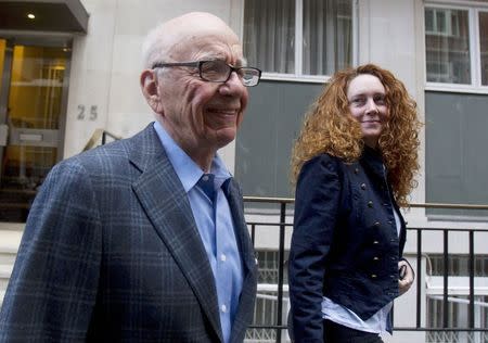 News Corporation CEO Rupert Murdoch is seen leaving his flat with Rebekah Brooks, chief executive of News International, in central London in this July 10, 2011 file photograph. REUTERS/Olivia Harris/Files