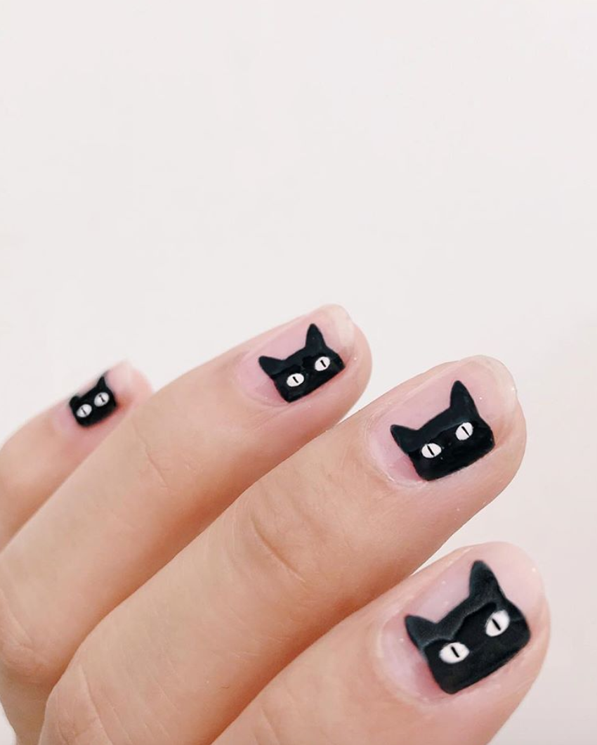 If this is too hard to DIY, try <a href="https://www.walmart.com/ip/SinfulColors-Claws-Halloween-Press-On-Nails-Cat-Call/919211790?selected=true" rel="nofollow noopener" target="_blank" data-ylk="slk:these press-ons;elm:context_link;itc:0;sec:content-canvas" class="link ">these press-ons</a> from SinfulColors for a similar look.