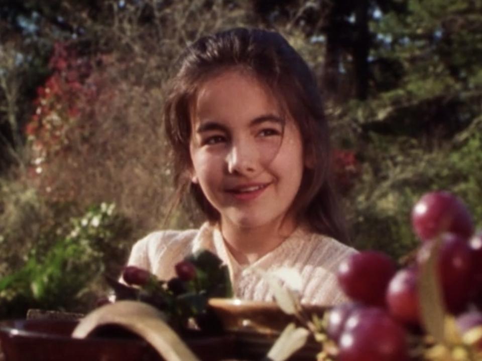 young sally eating in the garden in practical magic