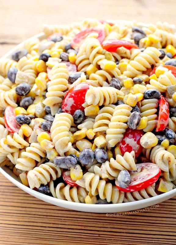 <p>She Wears Many Hats</p><p>This creamy pasta salad is filled with Tex-Mex flavors.</p><p><strong>Get the recipe:</strong> <strong><a href="http://shewearsmanyhats.com/black-bean-pasta-salad-recipe/" rel="nofollow noopener" target="_blank" data-ylk="slk:Southwestern Black Bean Pasta Salad;elm:context_link;itc:0;sec:content-canvas" class="link ">Southwestern Black Bean Pasta Salad</a></strong></p>