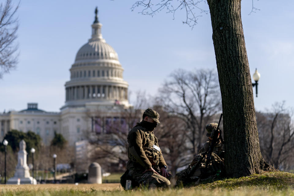Members of the National Guard work outside the U.S Capitol building on Capitol Hill in Washington, Thursday, Jan. 14, 2021. (AP Photo/Andrew Harnik)