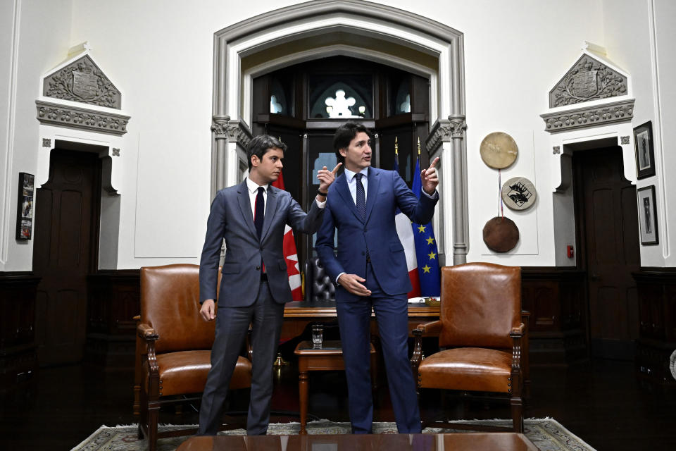 Prime Minister of Canada Justin Trudeau, right, and Prime Minister of France Gabriel Attal, look around the Prime Minister's office in West Block on Parliament Hill, before a meeting in Ottawa on Thursday, April 11, 2024. (Justin Tang/The Canadian Press via AP)