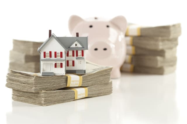 small house and piggy bank with ...