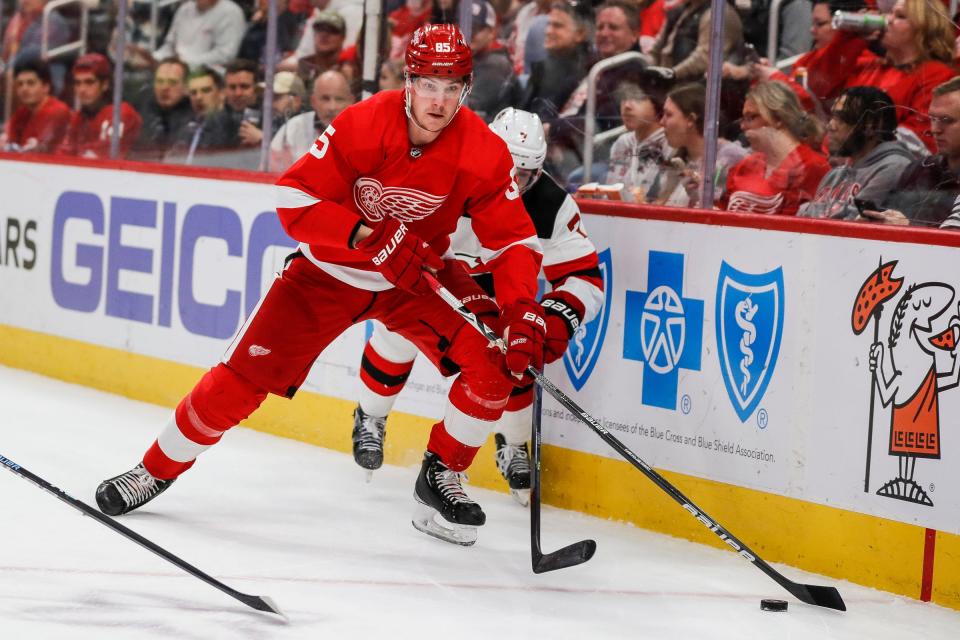 Detroit Red Wings left wing Elmer Soderblom (85) protests the puck against New Jersey Devils defenseman Dougie Hamilton (7) during the first period at Little Caesars Arena in Detroit on Wednesday, Jan. 4, 2023.