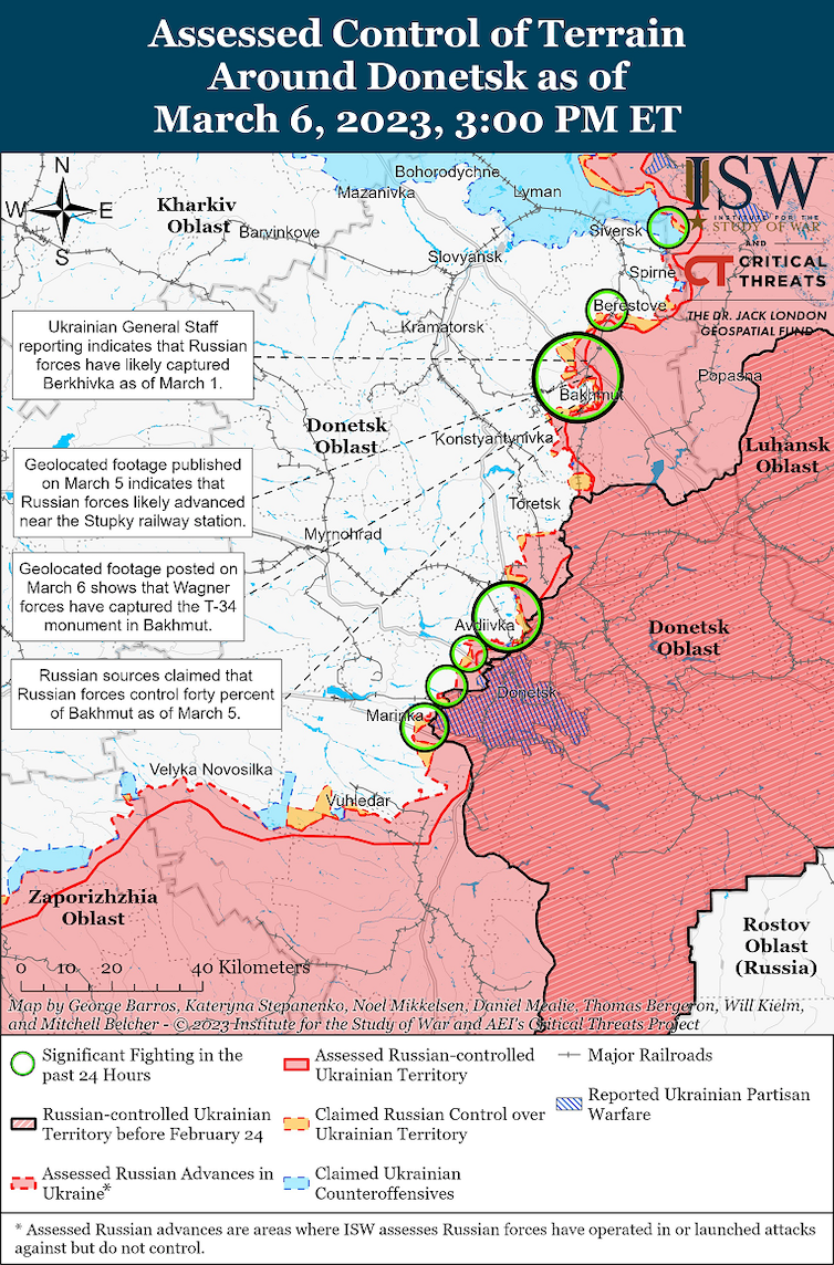 Map of conflict in Donbas region of Ukraine with Russian territory/advances in red and circles highlighting recent battles.