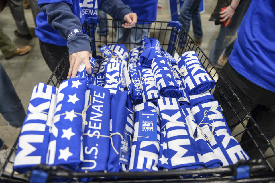 Volunteers pass out shirts for U.S. Sen. Mike Lee at the Utah Republican Party nominating convention, Saturday, April 23, 2022, in Sandy, Utah. (Chris Samuels/The Salt Lake Tribune via AP)