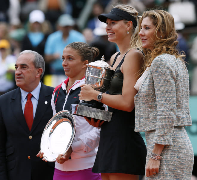 Russia's Maria Sharapova (2ndR) and Italy's Sara Errani (2ndL) hold their trophies Former tennis champion Monica Seles (R) and President of French Tennis Federation Jean Gachassin on the podium after their Women's Singles final tennis match of the French Open tennis tournament at the Roland Garros stadium, on June 9, 2012 in Paris. Sharapova won the final. AFP PHOTO / JACQUES DEMARTHONJACQUES DEMARTHON/AFP/GettyImages