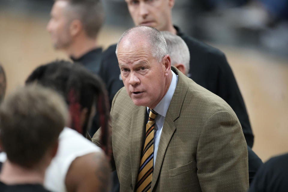 Colorado coach Tad Boyle confers with players during a timeout during the first half of an NCAA college basketball game Tuesday, Nov. 14, 2023, in Boulder, Colo. (AP Photo/David Zalubowski)