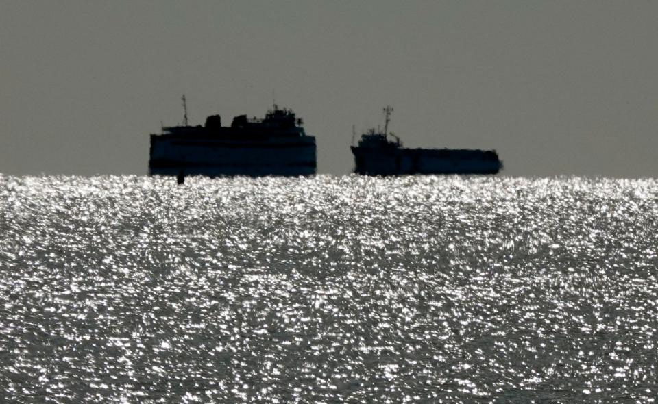 Two Steamship Authority vessels transporting to and from Nantucket pass on the sparkling water of Nantucket Sound off Osterville in March.