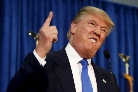 Republican presidential candidate Donald Trump gestures and declares "You're fired!" at a rally in Manchester, New Hampshire, June 17, 2015. REUTERS/Dominick Reuter