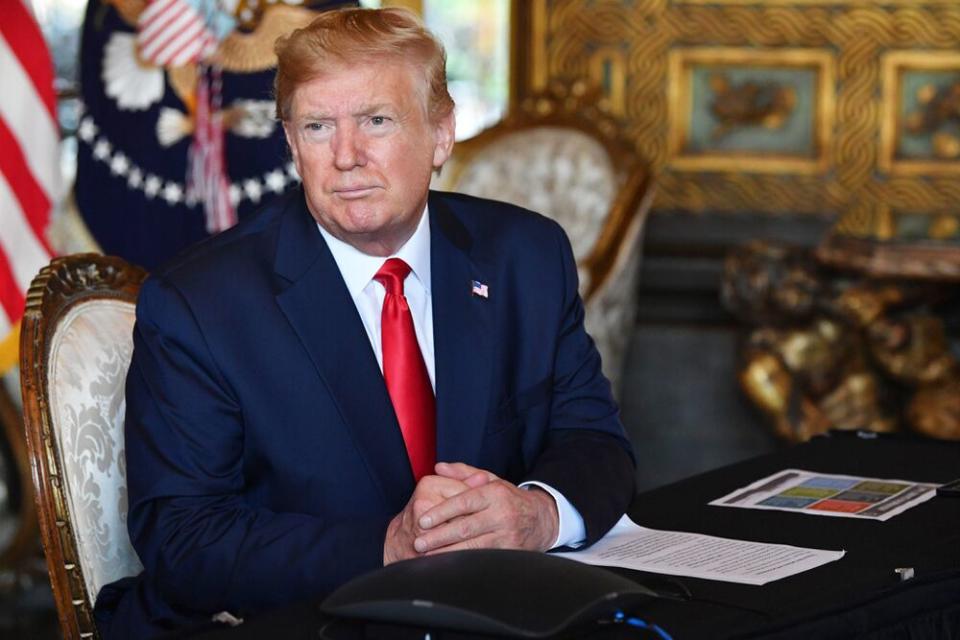 President Donald Trump at his Mar-a-Lago estate in Palm Beach, Fla., on Christmas Eve. | Nicholas Kamm/AFP via Getty