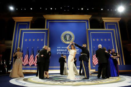 U.S. President Donald Trump, his wife Melania, Vice President Mike Pence and his wife Karen dance at the Armed Services Ball in Washington, U.S., January 20, 2017. REUTERS/Yuri Gripas