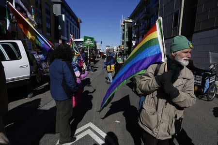 Gay rights advocates prepare to march in an equality parade immediately after the annual South Boston St. Patrick's Day parade in Boston, Massachusetts March 16, 2014. REUTERS/Dominick Reuter