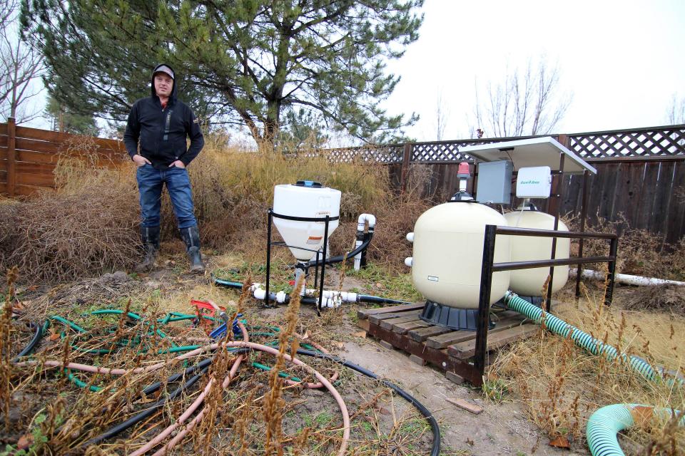 Kelby Johnson standing next to a sand filtration system used for drip irrigation on his 100-acre farm in Benson, Utah, Nov. 16, 2023. The Johnson family has worked the farm for the past 150 years and Kelby Johnson hopes his children will become fifth-generation farmers. But the Johnsons must withstand pressure to sell to developers and cut costs and water for the Great Salt Lake. | Jeffrey Dahdah, KSL-TV