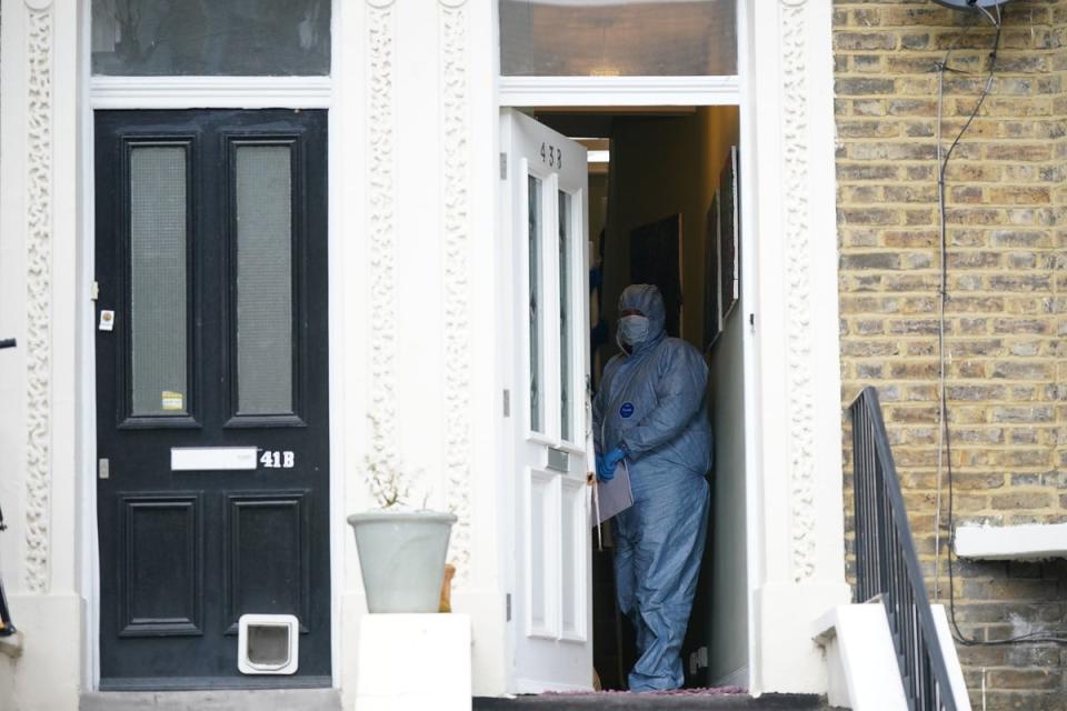 Forensic officers at a property on Montague Road in Dalston, east London, where the four-year-old died (PA)
