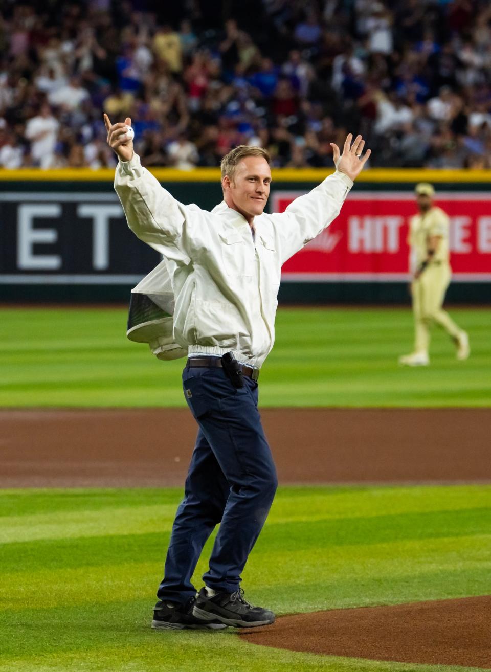 Beekeeper Matt Hilton throws out the first pitch prior to the Arizona Diamondbacks' game against the Los Angeles Dodgers at Chase Field.