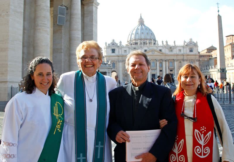 FILE PHOTO: Father Roy Bougeois from Georgia poses with a group of Roman Catholic activist in front of the Vatican