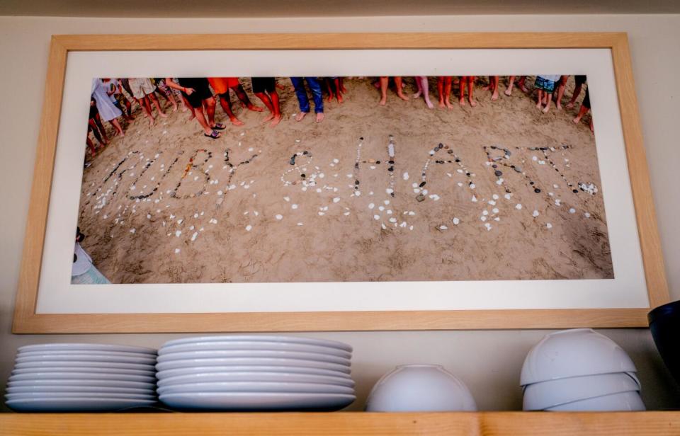 A photograph from a beach memorial to Ruby and Hart Campbell hangs in the desert vacation home.