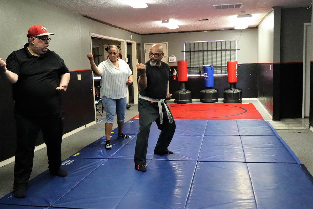 Senior karate instructor Don Burnell and his students James Suber and Angela Sheetz on their Saturday, May 11 class