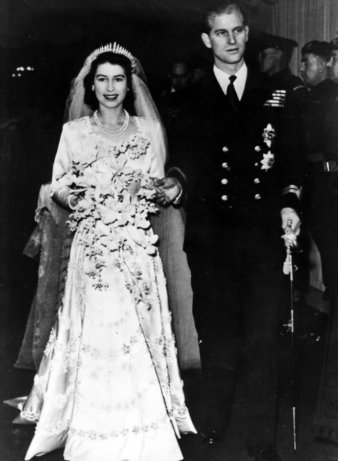 The happy couple walk down the aisle of Westminster Abbey in London on Nov. 20, 1947. Elizabeth, who was 21 at the time of her wedding, looks resplendent in a gown by Norman Hartnell. Philip, who became the Duke of Edinburgh upon his marriage, renounced his former Danish and Greek royal titles. The historic ceremony was broadcast around the world by BBC Radio.