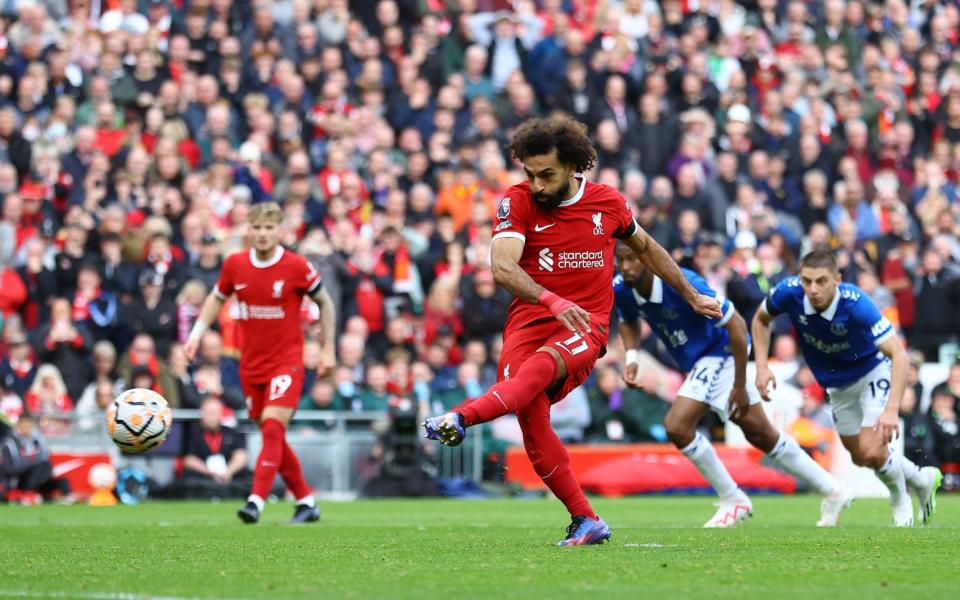 Mohamed Salah scores their first goal from the penalty spot